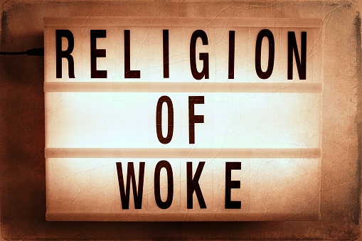 A Lightbox sign with the words 'Wokeism' on it for a Wokeism Religion concept. This is part of my Signs of the Times Collection for Social History.