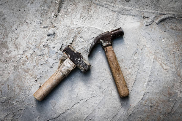 istock Old sledge hammer and old Claw hammer that lacks maintenance until rust corrodes the iron with concrete floor background, 1701580648