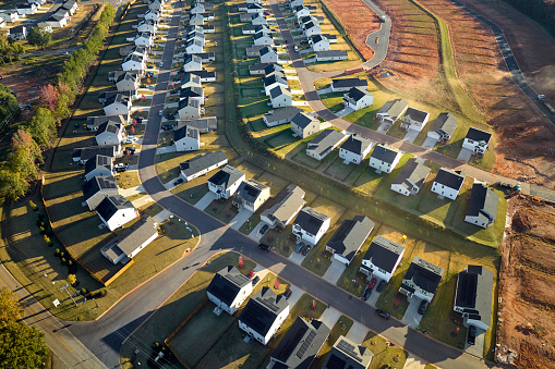 View from above of densely built residential houses under construction in south Carolina residential area. American dream homes as example of real estate development in US suburbs.