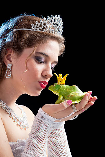 istock Blonde princess kissing a frog 170160305