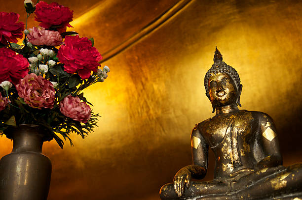 istock Gold Leaf Buddha Statue Golden Background 170160881
