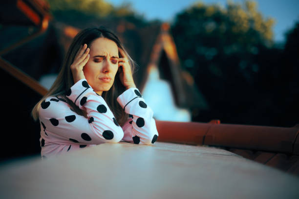 istock Stressed Woman Having a Headache in the Morning 1701611202