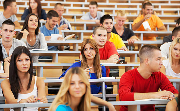 istock Large group of students sitting in classroom 170162148