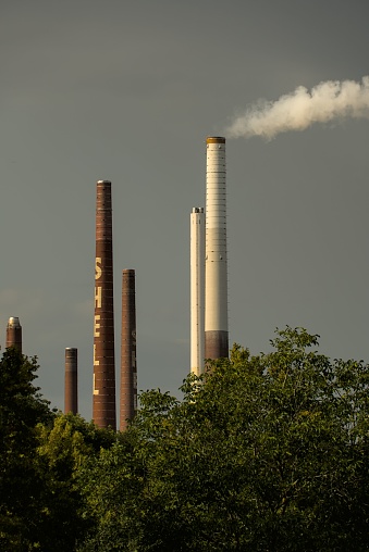 Cologne, Germany – August 27, 2023: An aerial view of Shell Oil Company industrial complex with brickstone chimneys