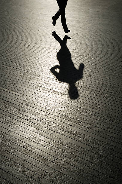 istock Shadow of Jogger Runs on Modern Stone Background 170162787