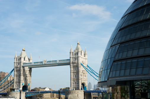 The curving profile of London City Hall contrasts with the Victorian Gothic style of Tower Bridge