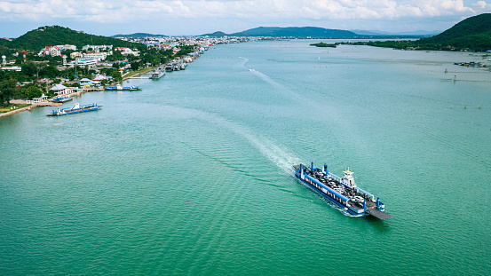Car ferry across Songkhla Lake to Singhanakhon. Aerial view of ferry-boat with Songkhla ancient town at Hua Khao, Singhanakhon, Songkhla.