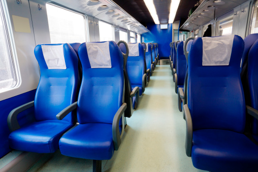 Train inside with empty seats.