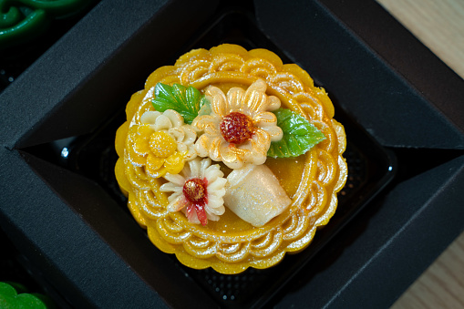 Close focus colorful hand made moon cake of Vietnamese with flower shape decorating