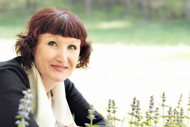 Relaxed Mature Woman Enjoying Nature in Spring