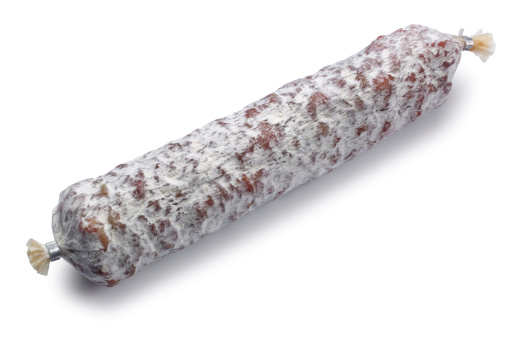 Dry cured sausage isolated on white.