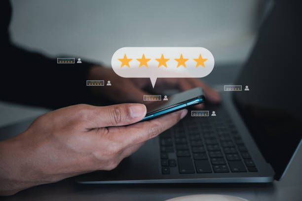 istock Man using smartphone and laptop computer to rate and evaluate services 1701726810