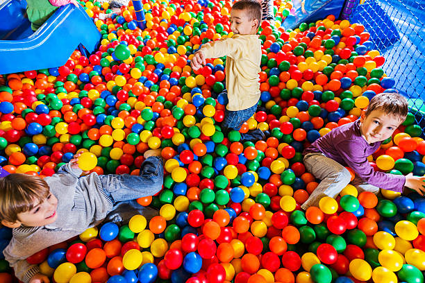 istock Cute little boys playing in the ball pool. 170173044