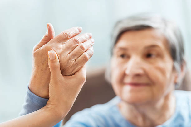 Senior woman having physical therapy. A senior woman receiving physical therapy.    alternative healthcare worker stock pictures, royalty-free photos & images