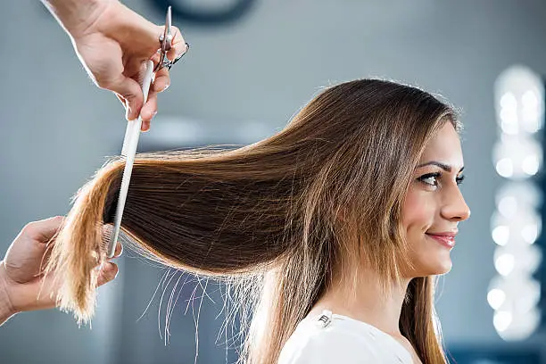 Photo of Young woman at the hairdresser's.