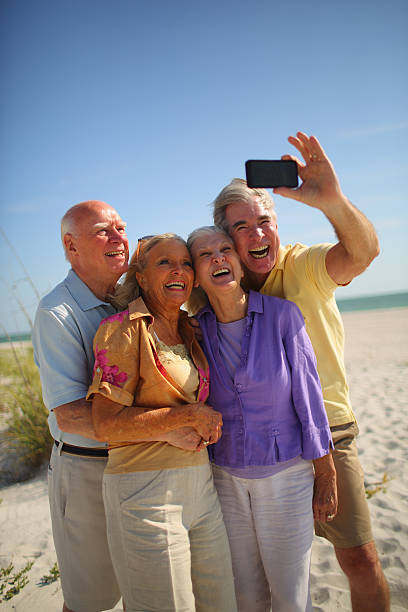 istock Happy Senior Group taking Self Portrait with Mobile Phone 170173911