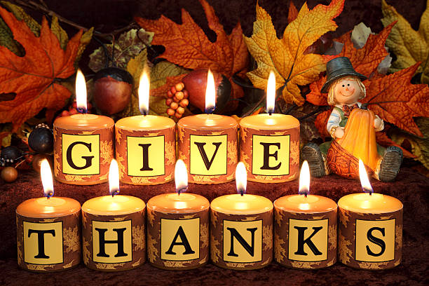 Cute scarecrow pilgrim holding pumpkin with \
