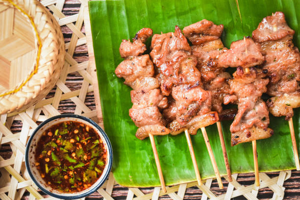 istock grilled pork thai style on banana leaf, top view, thai call Moo ping 1701747963