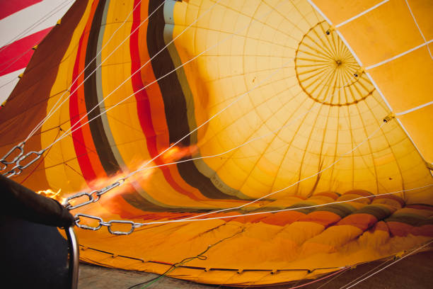 istock Colorful balloons flying over mountains and with blue sky 1701769963