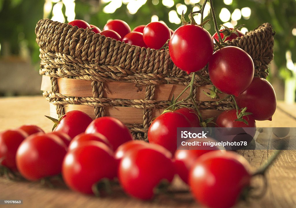 Cherry tomatoes on the wooden table Backgrounds Stock Photo