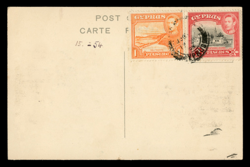 A postcard sent from Cyprus in 1954, with stamps bearing the portrait of King George VI. Cyprus was at the time part of the British Empire and was undivided.
