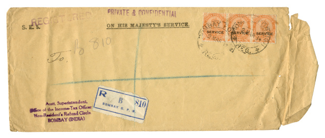 A registered income-tax-related “On His Majesty’s Service” envelope sent from Bombay, India, in 1934. The postage stamps bear the portrait of King George V - at that time, India was still part of the British Empire.