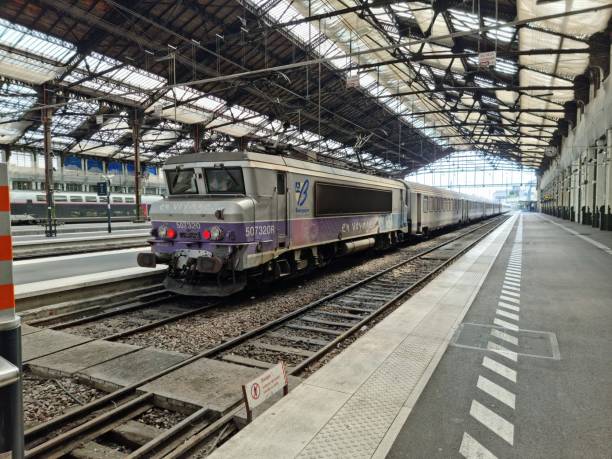The Gare de Lyon is one of the six large mainline railway station termini in Paris, France. It handles about 90,000,000 passengers every year, making it the third busiest station of France. The station was built for the World Exposition of 1900. The Image shows the Main arrival and departure Hall with an old train.