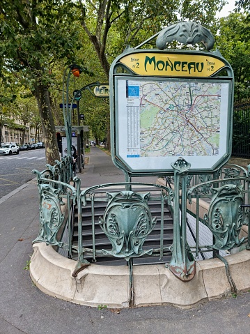 Monceauis a station on Paris Métro Line 2 near the Parc Monceau on the border of the 8th and 17th arrondissement of Paris.  The image shows the Entrance Metro Sign and the stairs to the station.