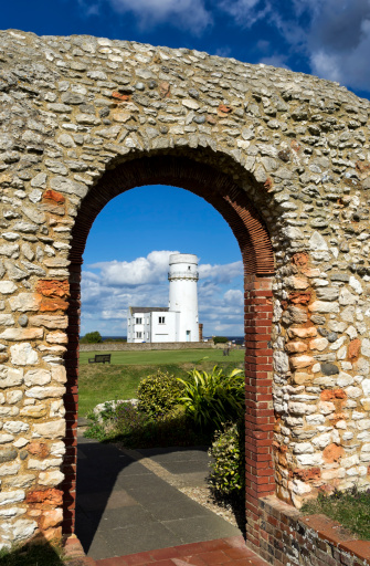 The lighthouse at Old Hunstanton, Norfolk, seen through the ruins of St Edmund’s Chapel on the cliffs. The lighthouse was built around 1840, on the site of a much older lighthouse structure which contained the world’s first parabolic reflector. The present building stopped operating as a lighthouse in 1921 and is currently used as holiday accommodation. St Edmund’s Chapel dates back to 1272.