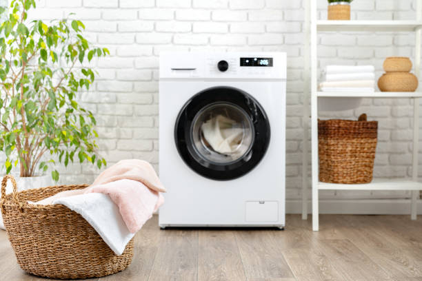 istock Modern white washing machine close up photo 1701807015