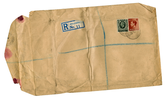 A scruffy old envelope, sent by registered post, from Chillingham in Northumberland, northern England, in 1936. It carries stamps of two kings - King George V and his eldest son King Edward VIII (who abdicated in 1937).