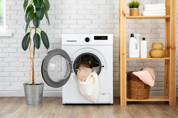 istock Modern white washing machine close up photo 1701818798