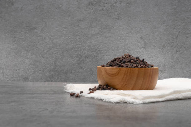 istock Himalayan black salt in bowl with cloth on stone texture background 1701830648