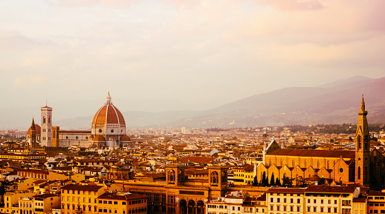 Golden sunrise over Cathedral of Santa Maria del Fiore (Duomo) and Basilica of Santa Croce - Florence, Italy.