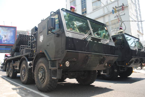 Battlefield cruiser truck belonging to the Indonesian Navy. Surabaya, Indonesia, 09-17-2023:
The anniversary of the Indonesian Navy is celebrated every September 10.
On Sunday, September 17, 2023, they held a carnival parade on Basuki Rahmat street, Surabaya, East Java, Indonesia. indigo truck stock pictures, royalty-free photos & images
