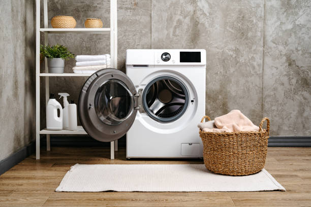 istock Washing machine in a gray modern laundry room 1701838383