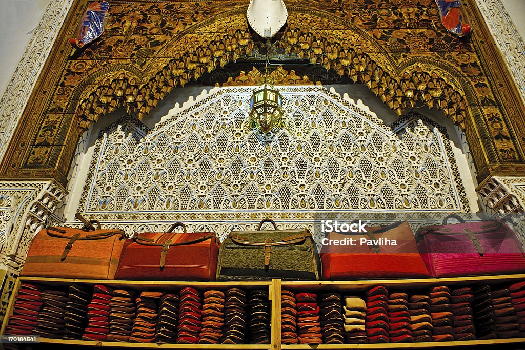 Street Shop with Bags and Slippers Fez Morocco Africa Beautiful shop offering bags and slippers, Morocco, Northern Africa. Africa Stock Photo
