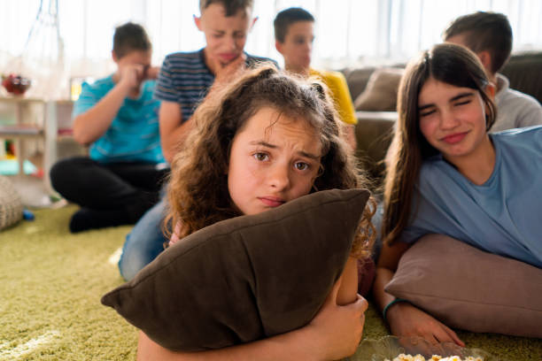istock Children watching sad movie at home 1701850297