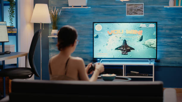 istock Caucasian woman winning videogames competition 1701866679