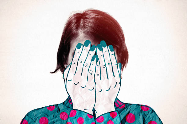 A woman covers her face with her hands in grief.  Art collage.