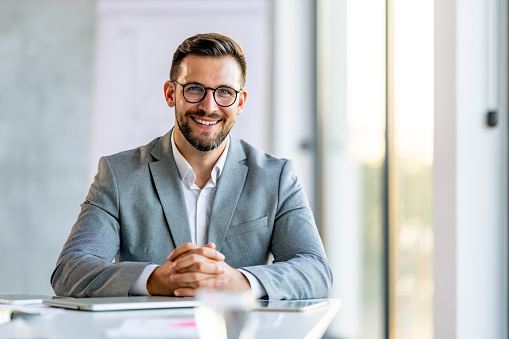 Successful businessman looking at camera with confidence