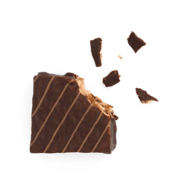 istock Chocolate coated cakes isolated on white background. Chocolate cake cube. Chocolate coated snacks. 1701884266