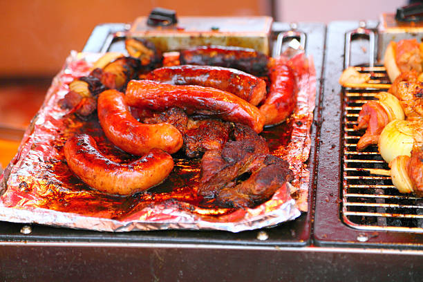 istock Grilled sausages and meat on the barbecue 170190339