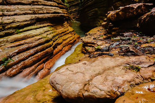 wonderful red canyon with lot of layers of the rocks and a fast flowing cold water in austria