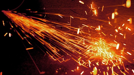 Sparks Flying from Angle Grinder When Cutting and Grinding Metal Slow Motion