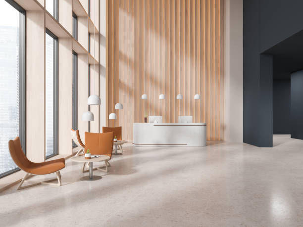 istock Cozy office interior with reception desk and relax space with panoramic window 1701928870