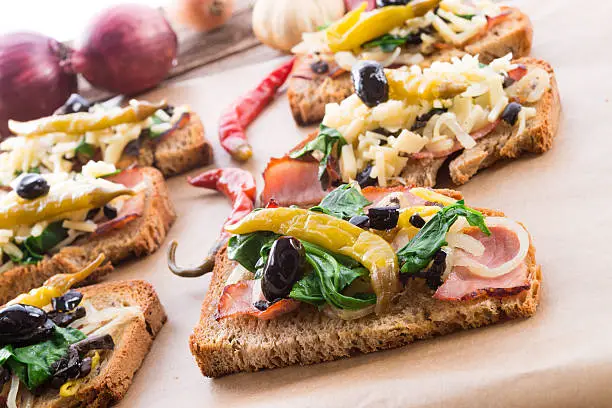 tasty appetizer of cheese and chives on sliced bread