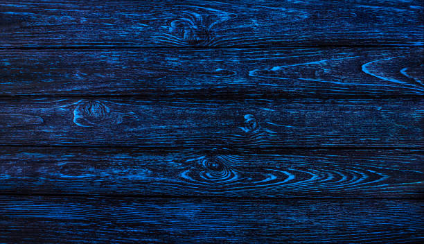istock Dark blue wooden background 1701956826