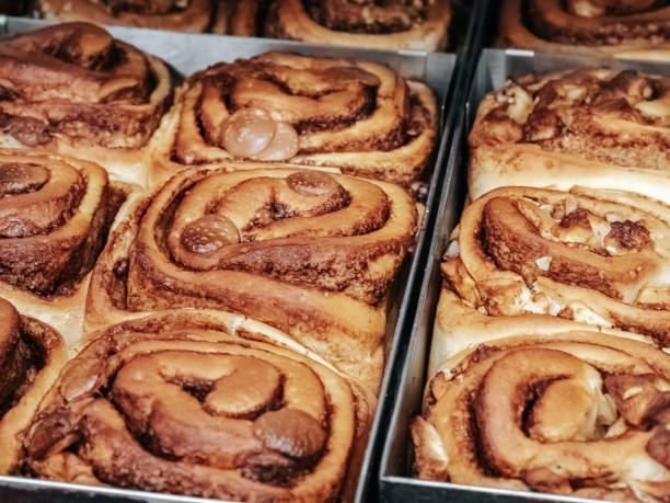 istock A cinnamon rolls (cinnamon bun, cinnamon swirl, cinnamon snail) close up. Fresh pastries in the bakery 1701962605