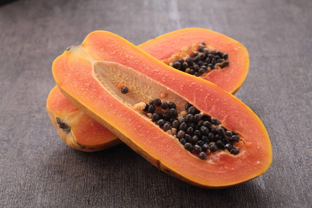 istock ripe and sweet papaya fruit on gray background 1701963187